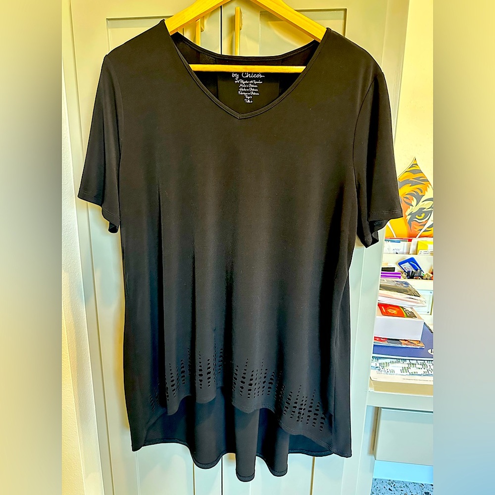 Chico’s size 2 black laser cut out high-low hem shirt.